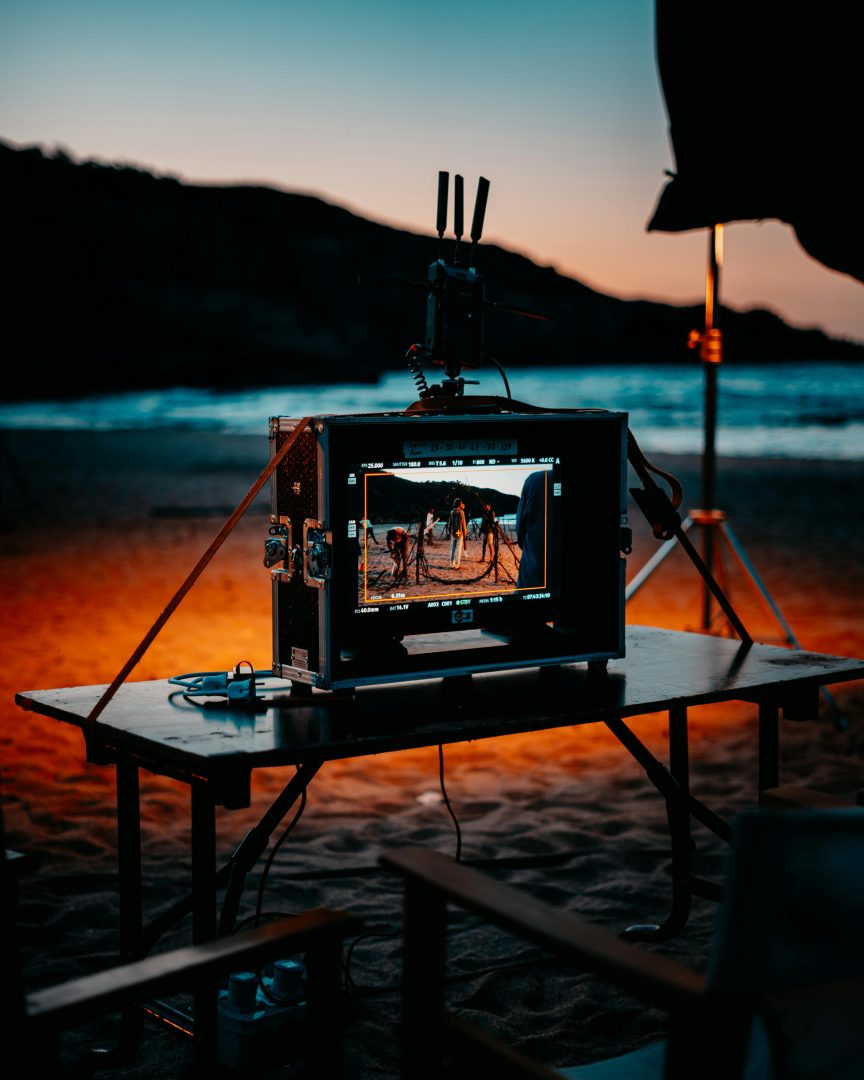 External Monitor set on a table on a beach during sunset time