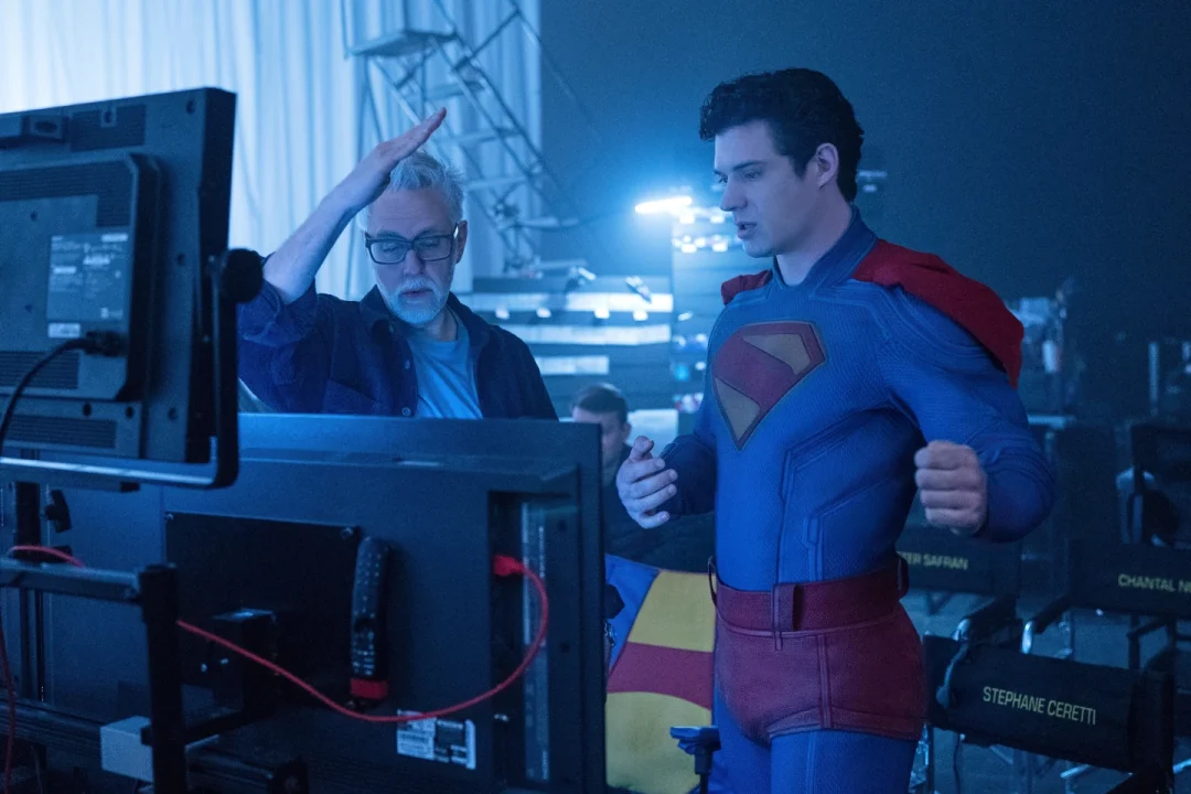 This image released by Warner Bros. Pictures shows David Corenswet, right, and director James Gunn on the set of “Superman.”