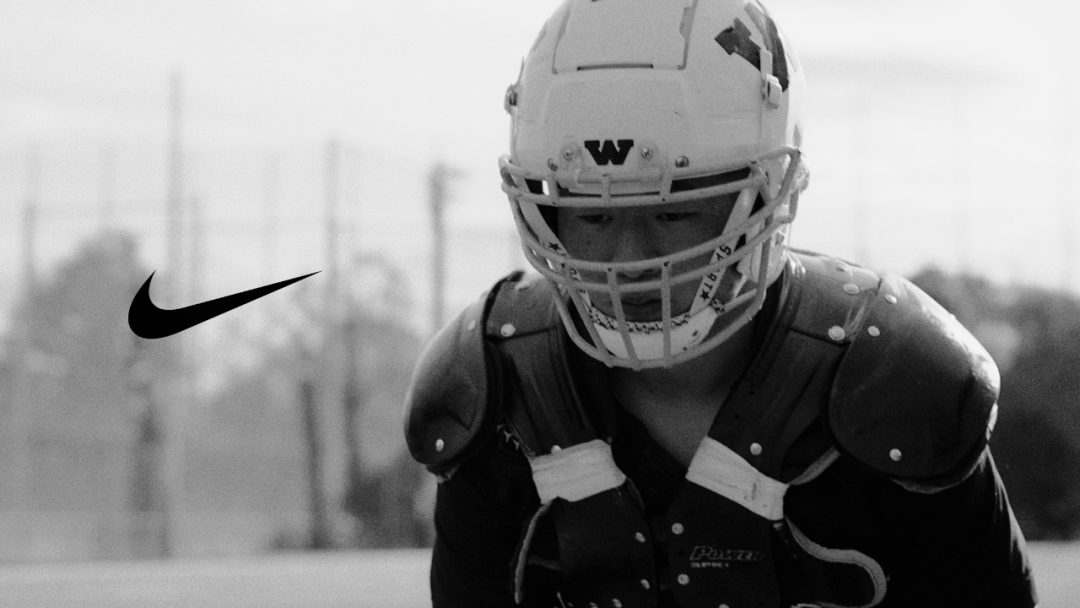 American football player in the field waiting for the whistle, nike logo